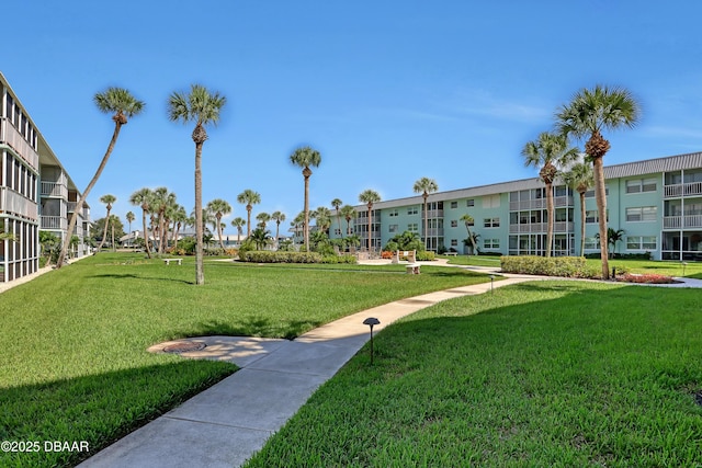 325 Causeway Cswy N Unit D104, New Smyrna Beach, FL 32169 - surrounding community featuring a lawn