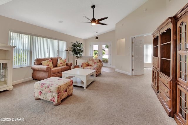 1329 Sunningdale Ln, Ormond Beach, FL 32174 - living area with french doors, ceiling fan, light carpet, and high vaulted ceiling