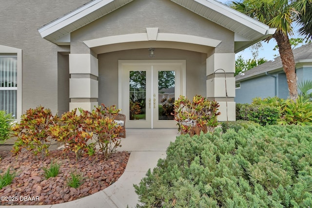 1329 Sunningdale Ln, Ormond Beach, FL 32174 - property entrance with french doors and stucco siding