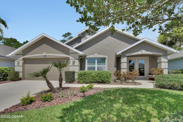1329 Sunningdale Ln, Ormond Beach, FL 32174 - view of front of property with french doors, a garage, concrete driveway, a front lawn, and stucco siding
