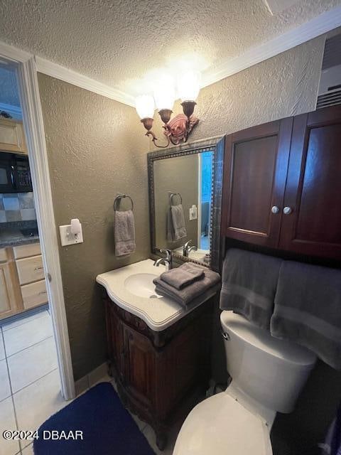 bathroom with ornamental molding, a textured ceiling, vanity, tile patterned floors, and toilet