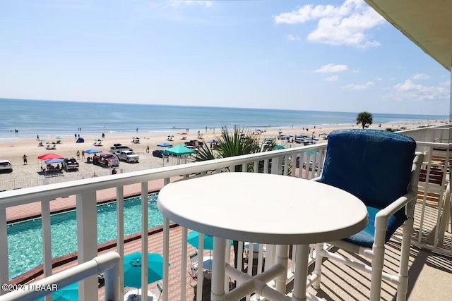 balcony with a beach view and a water view