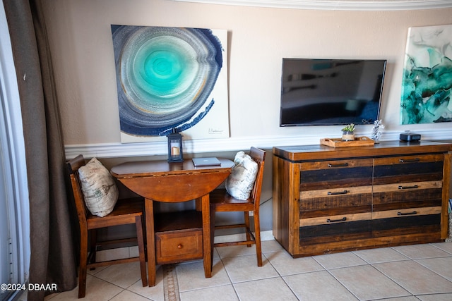 dining area with light tile patterned floors