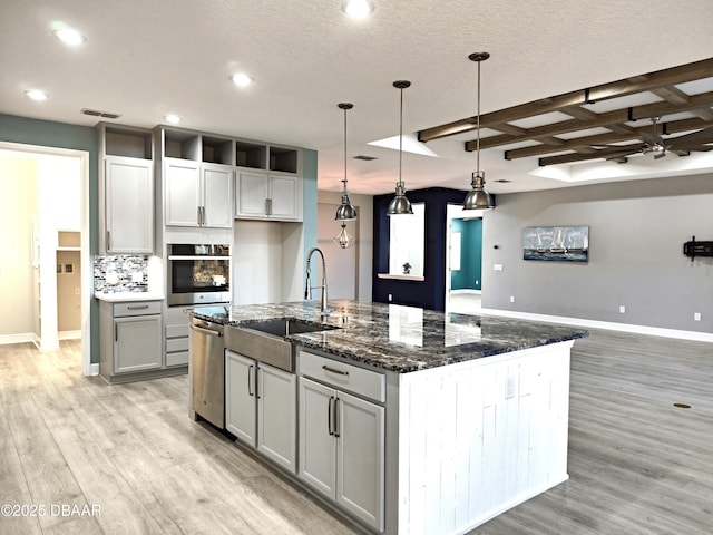 894 Attitude Ave, Daytona Beach, FL 32124 - kitchen featuring stainless steel appliances, a sink, light wood-type flooring, baseboards, and recessed lighting