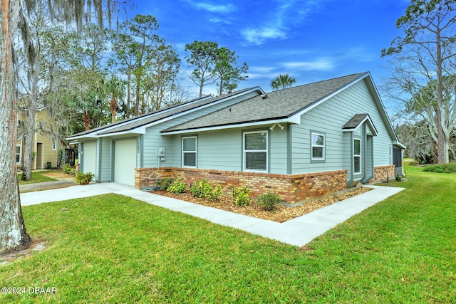 view of front of house with a garage and a front yard