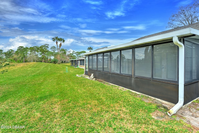 view of yard with a sunroom