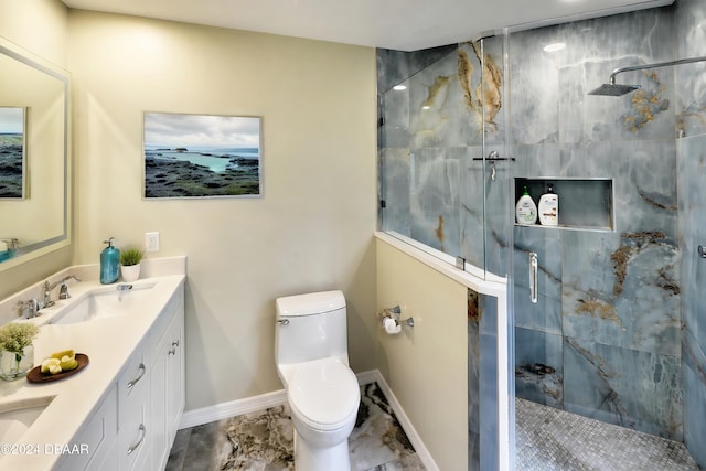 bathroom featuring vanity, toilet, and a shower with shower door