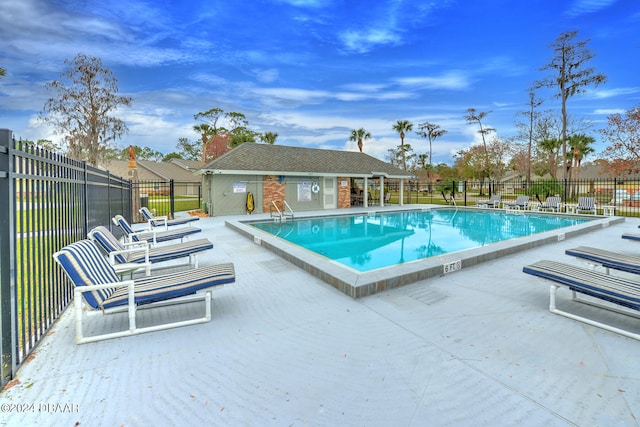 view of swimming pool with a patio area