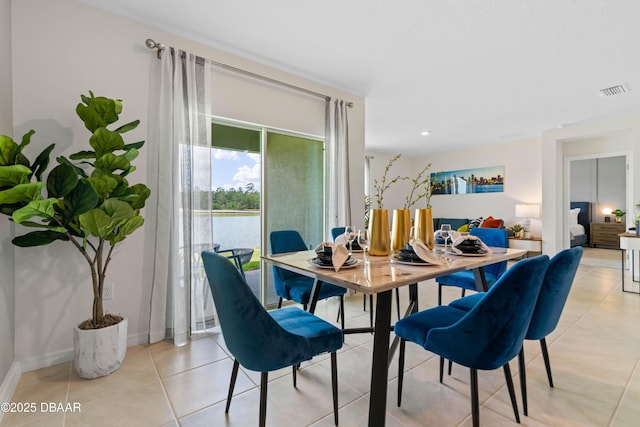 dining area with light tile patterned floors