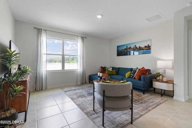 living room featuring light tile patterned flooring