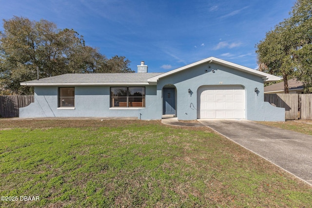 ranch-style house featuring a garage and a front yard