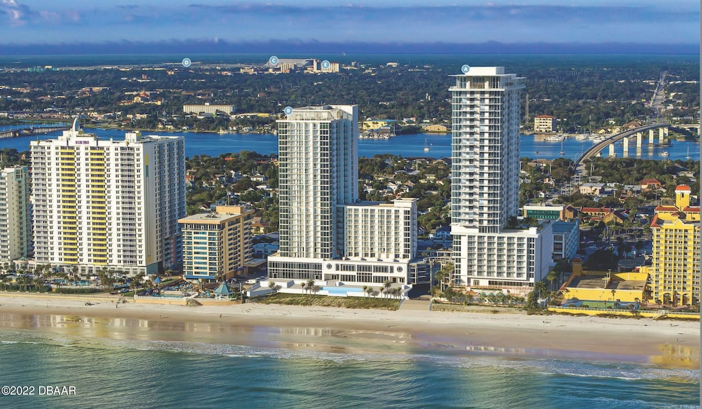 property's view of city featuring a beach view and a water view