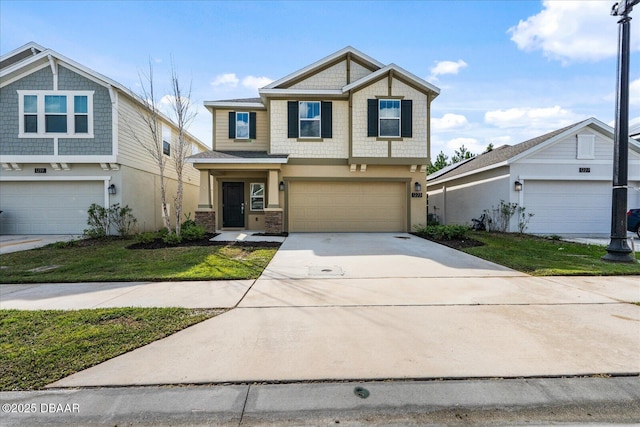 craftsman inspired home featuring stucco siding, driveway, a front yard, and a garage