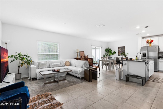 1223 Cabot Cliffs Dr, Daytona Beach, FL 32124 - living room with plenty of natural light, visible vents, and light tile patterned floors
