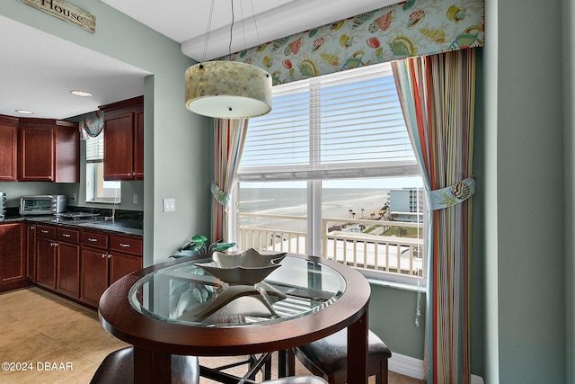 kitchen featuring light tile patterned floors and decorative light fixtures