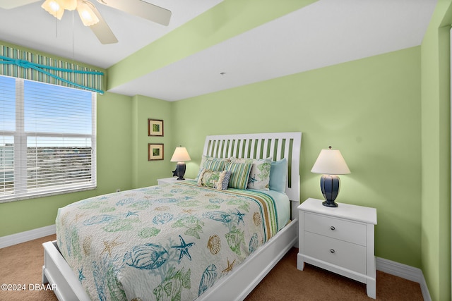 bedroom with ceiling fan and carpet