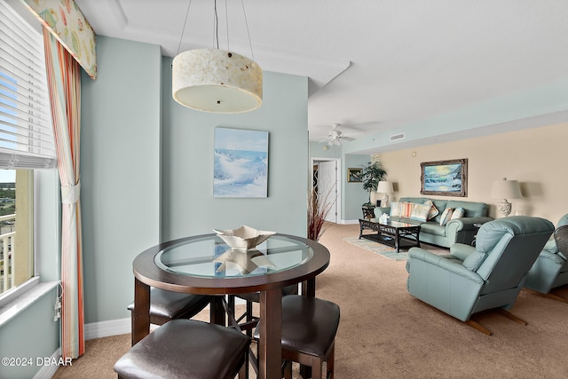 dining area featuring carpet flooring and ceiling fan