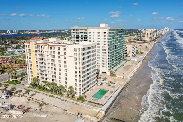 bird's eye view featuring a beach view and a water view