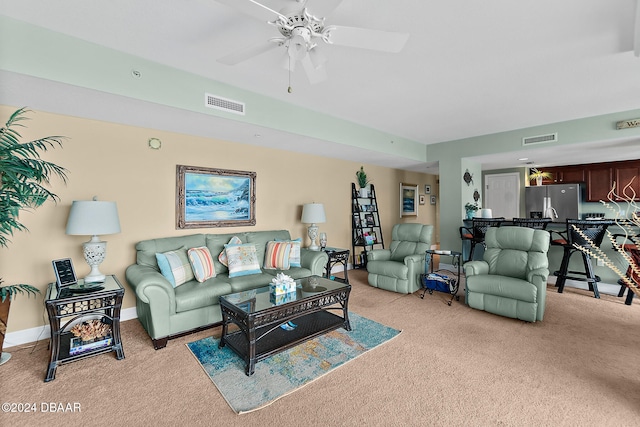 living room featuring light carpet and ceiling fan