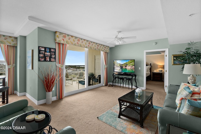 living room featuring carpet flooring and ceiling fan