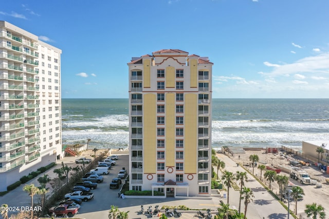 view of property featuring a water view and a view of the beach