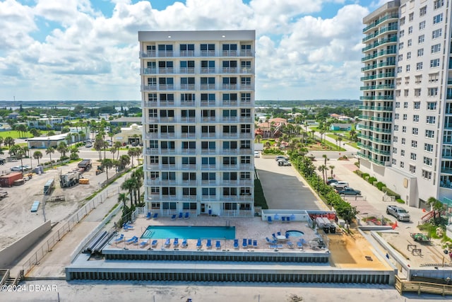 view of building exterior with a community pool