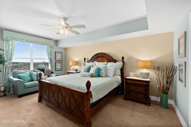 bedroom featuring light colored carpet and ceiling fan