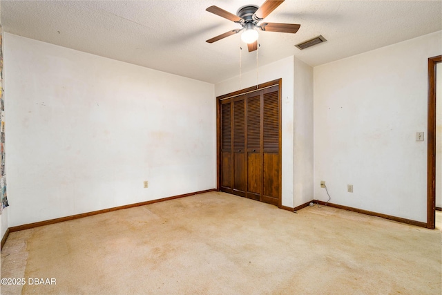 unfurnished bedroom with visible vents, carpet, baseboards, and a closet