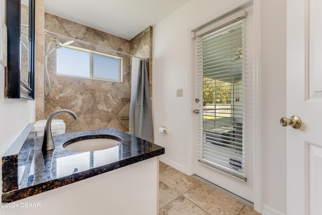 bathroom featuring tile patterned floors, vanity, a healthy amount of sunlight, and a shower with shower curtain