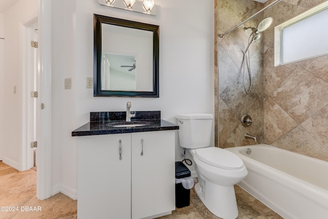 full bathroom featuring tile patterned flooring, vanity, toilet, and tiled shower / bath