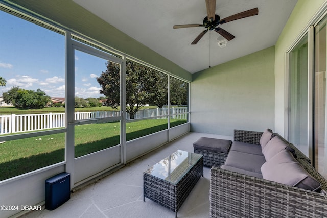 sunroom with vaulted ceiling and ceiling fan