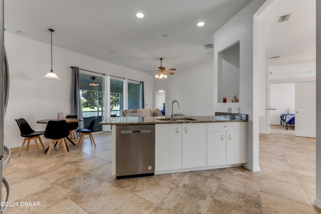 kitchen featuring dishwasher, sink, stone counters, white cabinetry, and decorative light fixtures