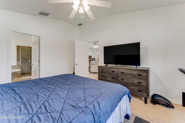 bedroom featuring light colored carpet, lofted ceiling, ceiling fan, and connected bathroom