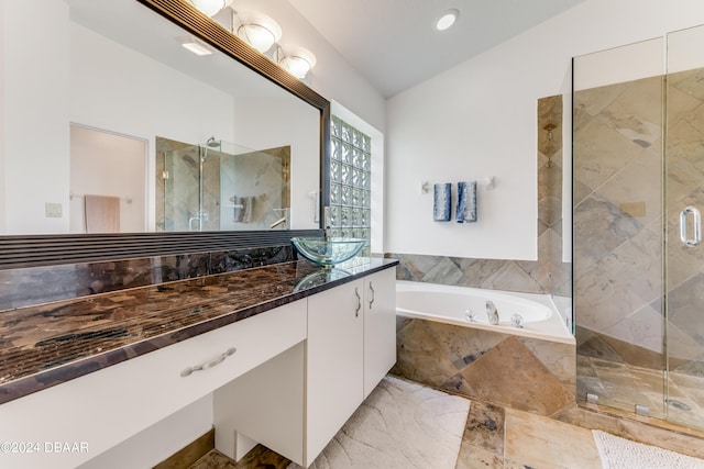 bathroom with vanity and separate shower and tub