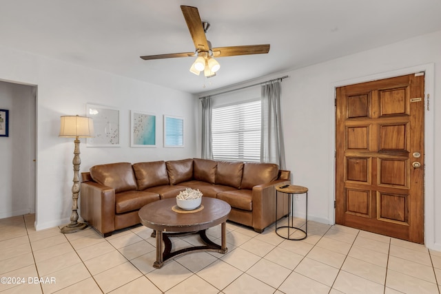 living room with light tile patterned floors and ceiling fan