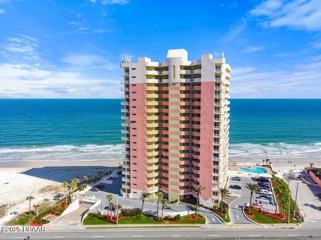 property view of water featuring a beach view