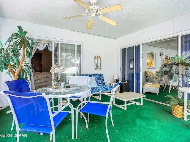 view of patio / terrace featuring ceiling fan