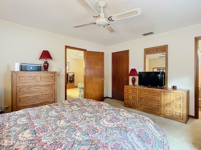 bedroom featuring a textured ceiling and ceiling fan