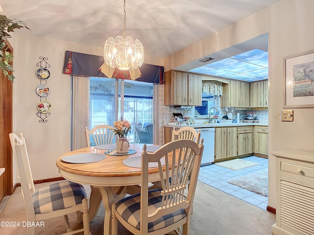 tiled dining space featuring sink and an inviting chandelier