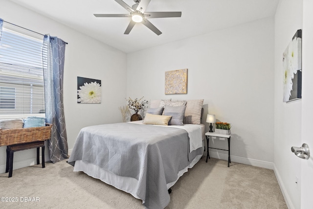 bedroom featuring ceiling fan and light carpet