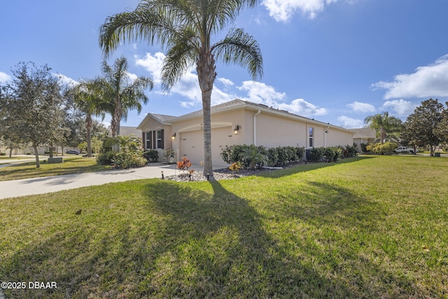 view of side of property featuring a yard and a garage