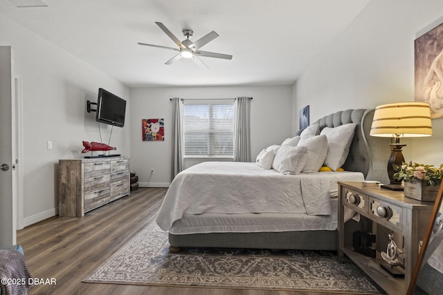 bedroom featuring ceiling fan and dark hardwood / wood-style flooring