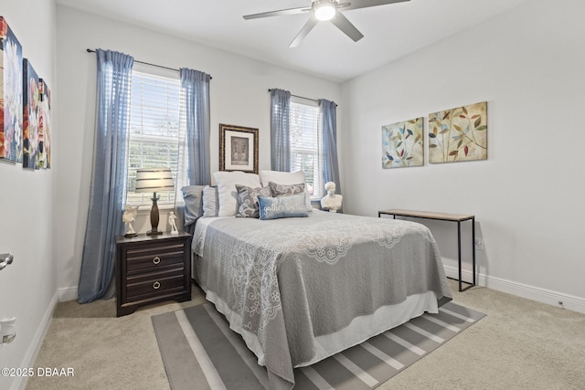 bedroom featuring light carpet and ceiling fan