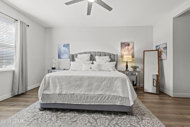 bedroom with hardwood / wood-style flooring and ceiling fan