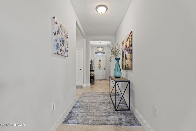 hallway featuring a textured ceiling