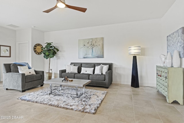 tiled living room featuring ceiling fan