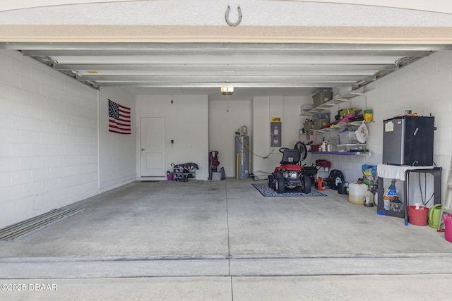 garage featuring a garage door opener and water heater