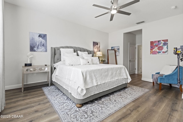 bedroom featuring dark hardwood / wood-style floors and ceiling fan