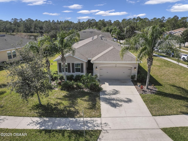 view of front of house with a garage and a front yard