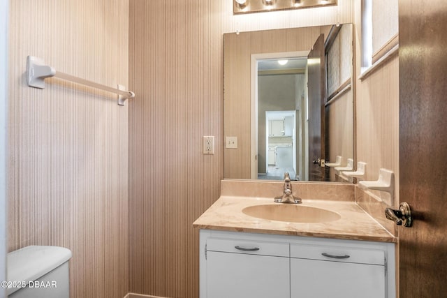 bathroom with vanity and toilet